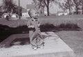 1962- Pete Bell, son of Don+Joyce Bell, by well at Leonard+Mabels farm (Brown farm in back)