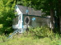 P1080864 House near a roadside chapel, north of Quebec City