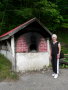 P1080865 Mary Ann by Marie's bread oven, in Chateau Richer near St Anne de Beaupre